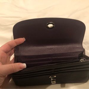 Genuine Coach plum colored leather turnlock wallet